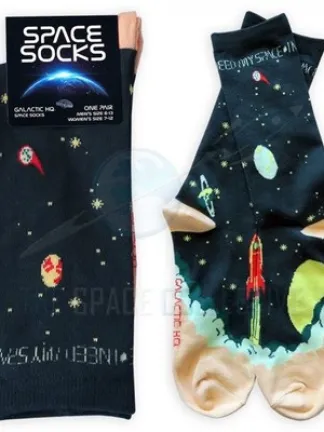 I Need My Space Socks are navy with illustrations of rockets taking off among planets