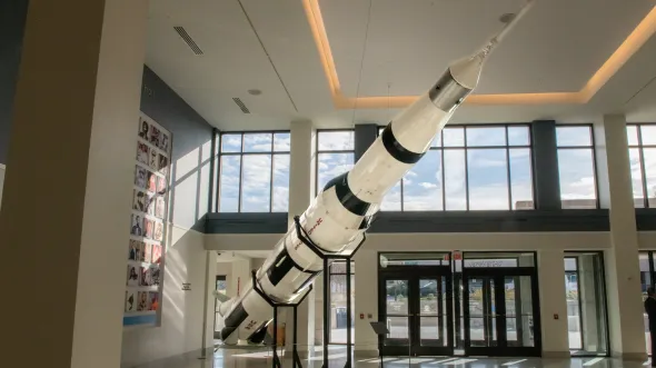 A large-scale model of the Saturn V Rocket reaches almost from the floor to the ceiling in the VMHC's Commonwealth Hall. 