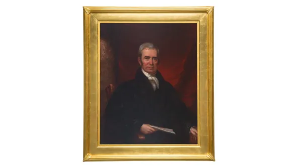 Gold framed painted portrait of John Marshall seated in dark robes with a red curtained background