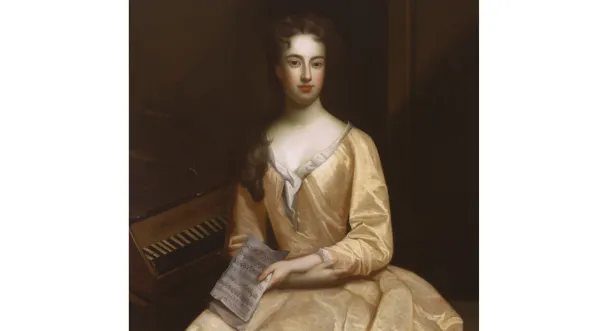 Painting of a woman in 1700s-era golden-colored dress, seated and holding an open book