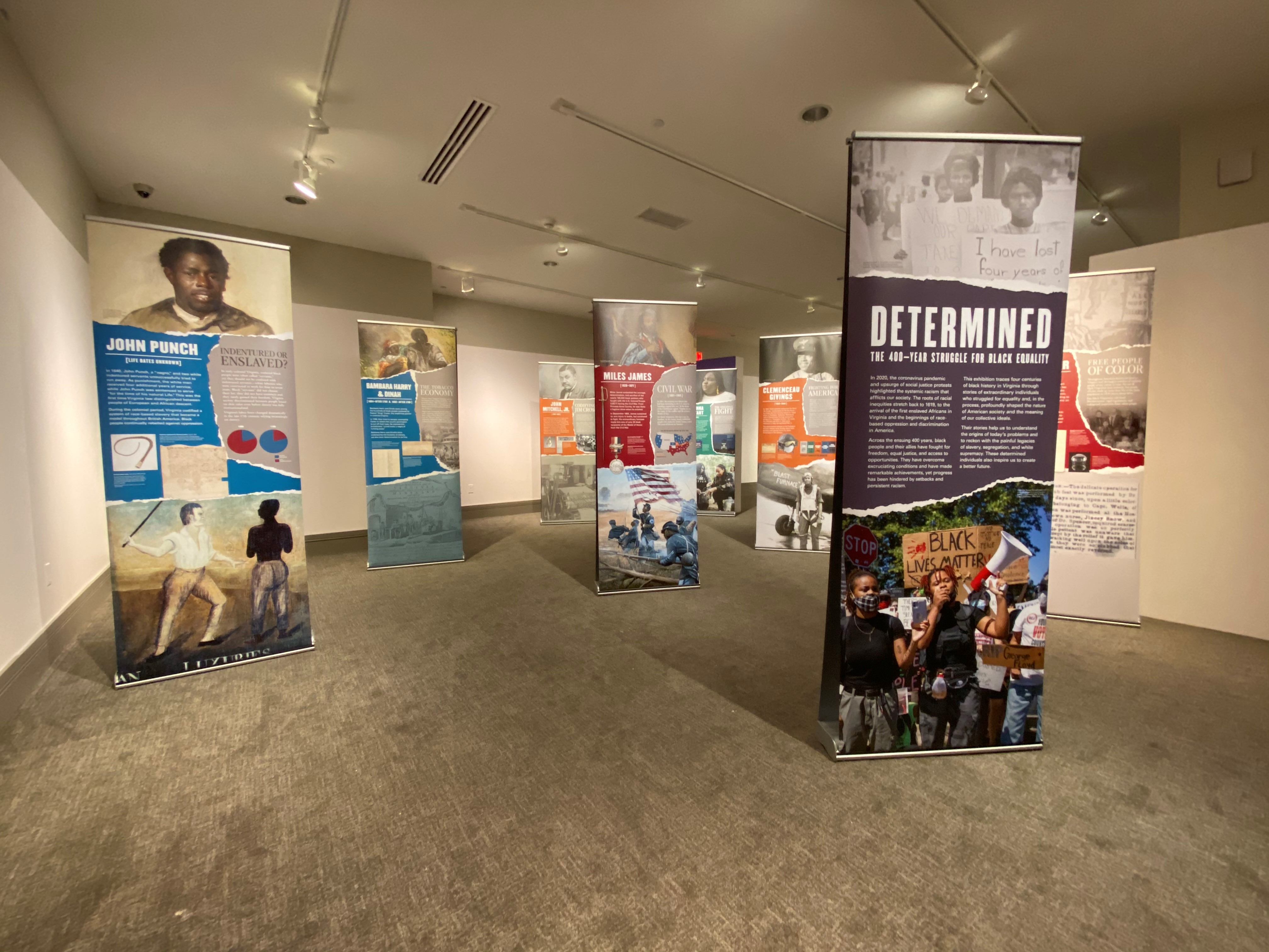 Determined Traveling Exhibition Banners on full display in gallery