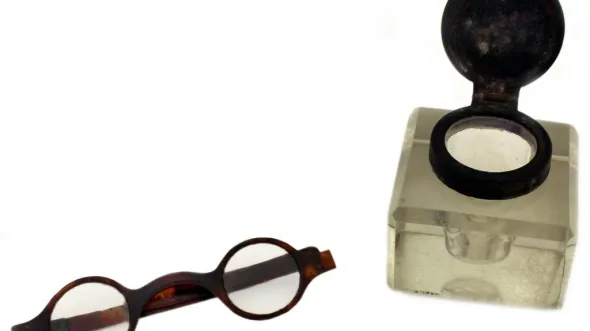 A photograph of Marshall's spectacles and inkwell