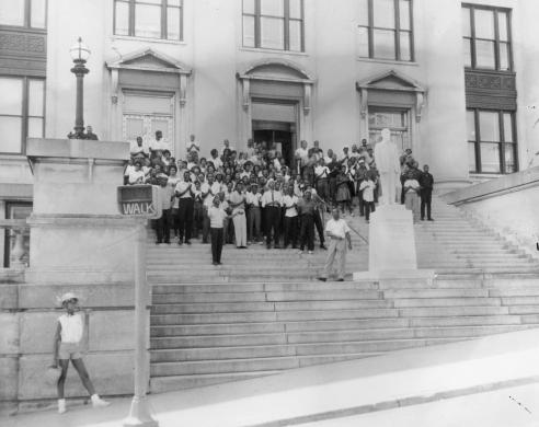 Black and white photograph of assembly members standing on the steps of a municipal building at the Danville protest, June 10, 1963  
