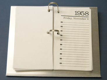Aluminum Calendar Holder, Reynolds Metals Company. The calendar holder is part of aluminum office furnishings and accessories manufactured by General Fireproofing Company and showcased in the 1958 Executive Office of Reynolds Metals Company in Richmond, Virginia. (VHS Accession number: 2001.522.10.L) Reynolds Aluminum Desk Calendar