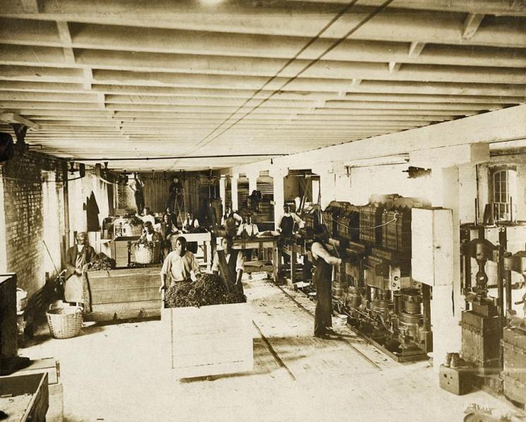 Larus & Brother Tobacco Company, Richmond, c. 1911 (VHS accession number: 2001.230.560). Photograph, Larus & Brother Tobacco Company, Tobacco Pressing. Image shows process of tobacco pressing. Larus & Brother Tobacco Company, Richmond, c. 1911