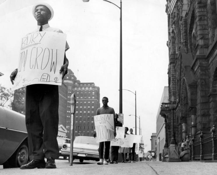 Protester with sign, "Bury Jim Crow"