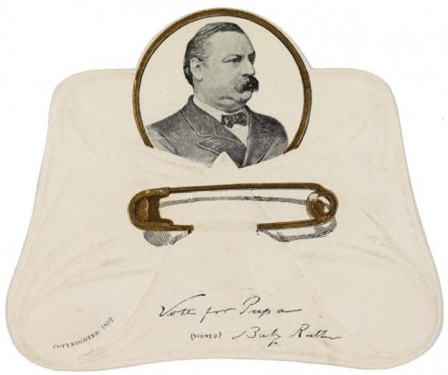 An advertisement card, in the form of a diaper, with a picture of Grover Cleveland. The inscription reads: "Vote for Papa signed Baby Ruth." It was meant as an endorsement of Cleveland by his newborn child.