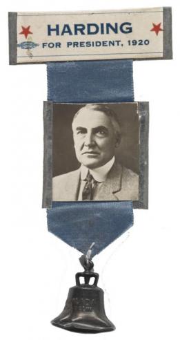 Blue campaign ribbon with a black and white photograph of Warren Harding and the words, “HARDING FOR PRESIDENT, 1920” with a silver bell below. 