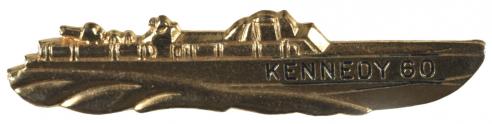 A pro-Kennedy tie clasp in the shape of a PT boat from World War II