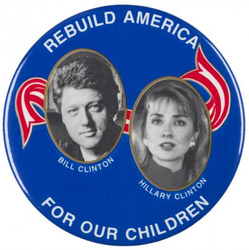 A blue campaign button with photographs of Bill and Hillary Clinton with the text, “REBUILD AMERICA FOR OUR CHILDREN.”