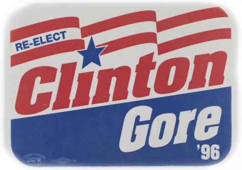 A red, white, and blue button with the text, “RE-ELECT Clinton/ Gore ‘96.”