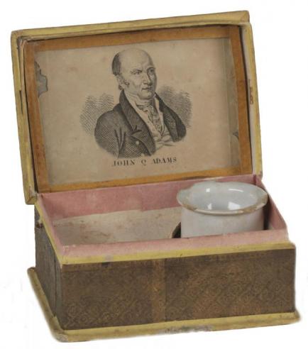 A cardboard sewing box with a portrait of John Quincy Adams