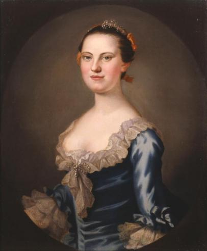 Portrait of Mary Willing Bird in a blue gown with white ruffled trim along the sleeves and neckline looking forward.
